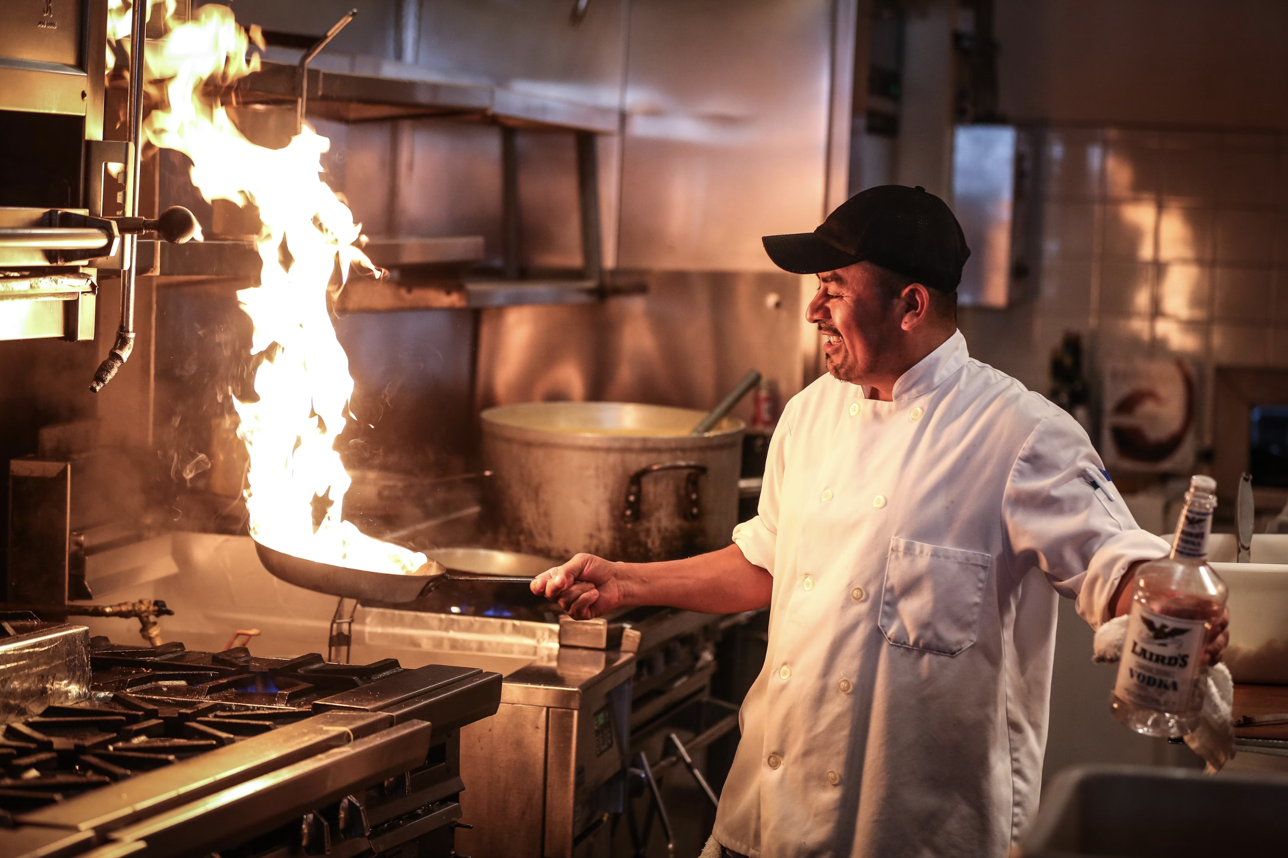 Man with fire in kitchen
